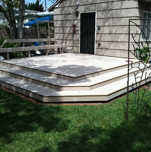 small wood deck in front of storage
