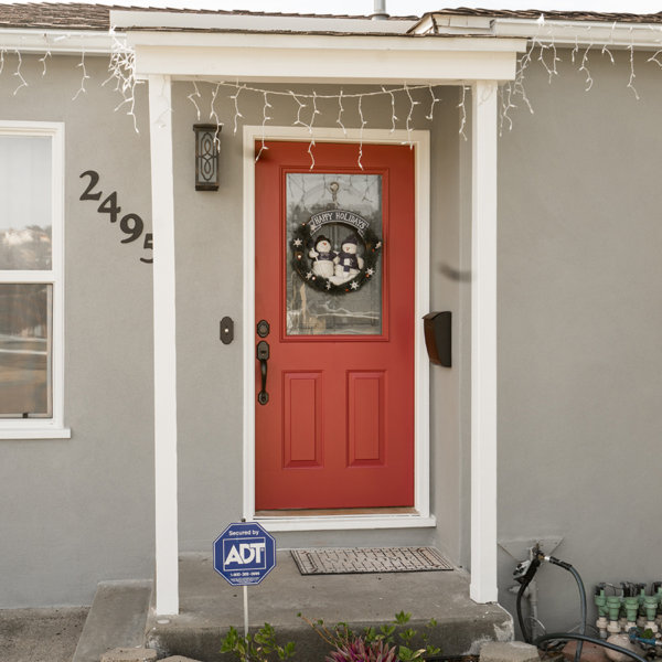 bright red front door on stucco house