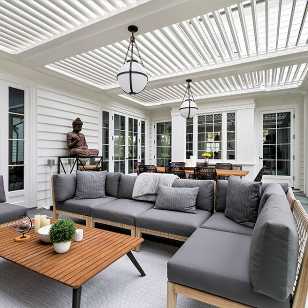 outdoor living area with louvered patio cover